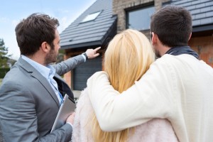 View of a Real estate agent shows details to customers